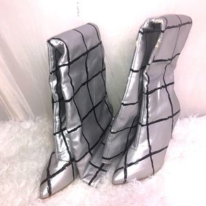 Black and silver thigh-high stiletto boots